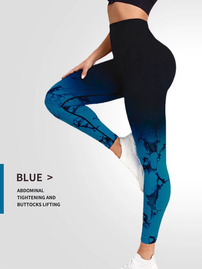 “Woman wearing high-waisted blue tie-dye seamless leggings, posing sideways to show fit and shape. Designed for workouts and gym use.”