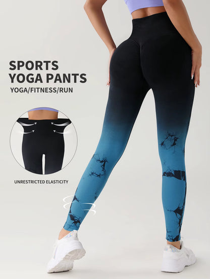 “Woman wearing high-waisted blue tie-dye seamless leggings, posing sideways to show fit and shape. Designed for workouts and gym use.”